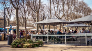 Cours de la Republique, market and restaurants in Narbonne in winter Cours de la Republique, market and restaurants in Narbonne in winter